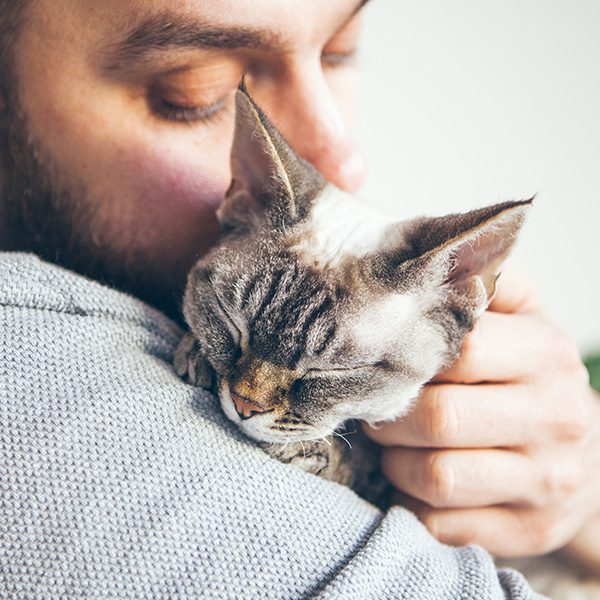 Close Up Of Man Hugging Cat